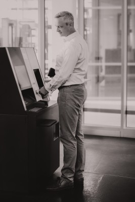Customer at an ATM b/w